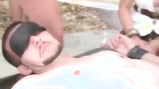 Blindfolded guy gets fucked as crowd of females watch him