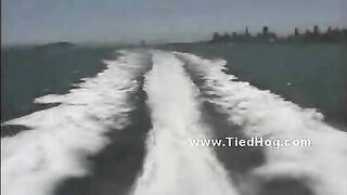 Babe held prisoner on a boat naked and tied with hands and legs behind in uncanny position