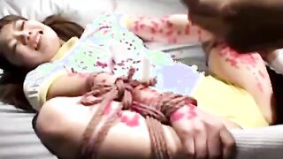 Jap whore gets hot wax over her body from her master