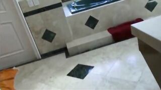 Girlfriend filmed while taking a shower and she goes on her knees to suck