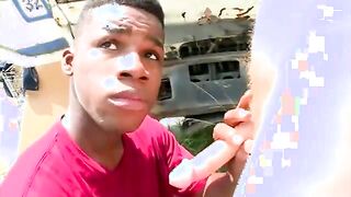 Black gansgsta sucks a white dong outdoor