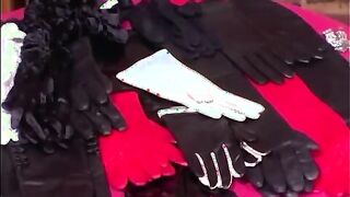 Domina tests her gloves on slaves cock