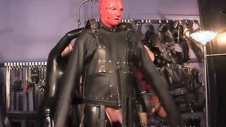 Dominas put gimp in a straight jacket