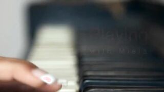 Busty blond toying snatch on the piano