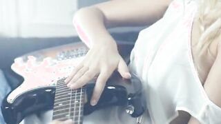 attractive blonde and her guitar