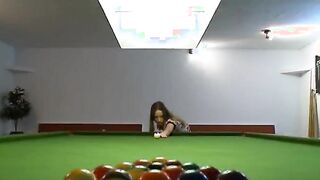 Two women in shoes on billiards table