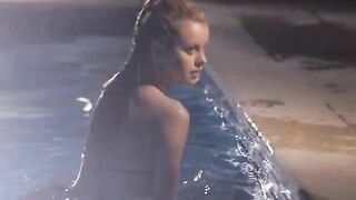 Poolside striptease of horny babe