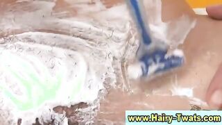 Hoe shaves pussy and gets hot