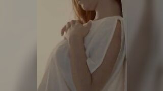 Unbeliveably busty redhead undressing