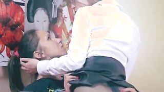 Two horny girls having sex on red sofa