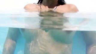 Naughty undine naked in the swimmingpool