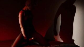 Blondie undressing with her strap on