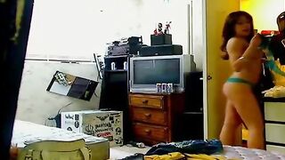 Brunette Girl Getting Dressed On Hacked Web Camera