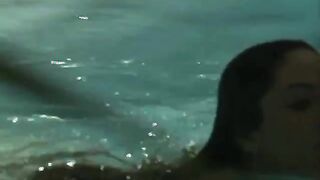 Sexy young horny brunette swims naked