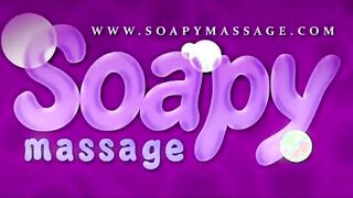 Beautiful blonde therapist pleases client with soapy massage