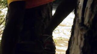 Opening cunt lips outdoors