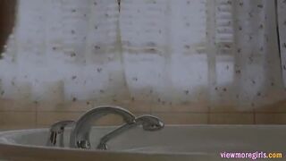 Busty Eufrat gets steamy and rubs her pussy in the bathtub