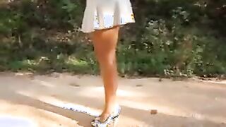 Outside Wearing A Skirt And Heels