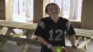 Kitty playing in a football jersey and miniskirt