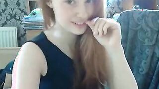 Hot redhead with pale skin fingers her tight pussy 