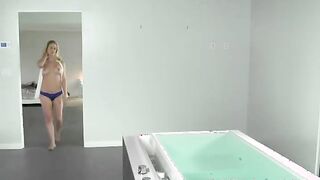 Young supple sexy blonde takes a warm bath