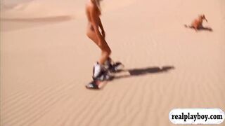 Huge tits babes try out sand boarding while naked