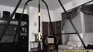 Milf plays with herself on sex swing