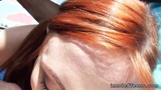 Redhead cheerleader deep throats in car