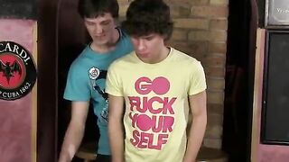 Twink boy kneels to blow another guy