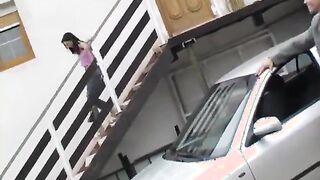 Michelle banged on the rubber hood of a car