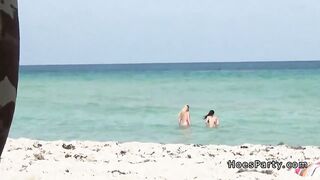 Foursome party in a tent at the beach