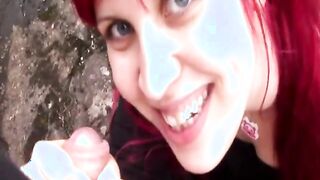 Redhead girl blows cock outdoors