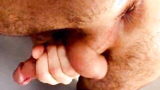 Sweet brunette gay Duke licking his sexy body and wanking cock under briefs at the desk