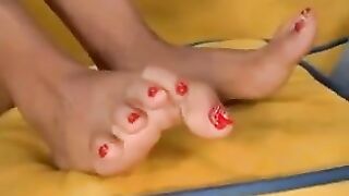 Enjoying Her Feet And Pussy