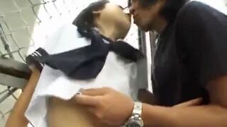 Japanese teen Rina sucks cock outdoors