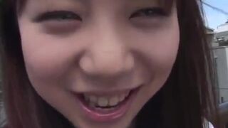 Asian teen poses outdoors before masturbating