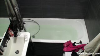 Blonde sweetheart plays with pussy in the bathtub 