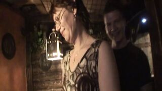 Young guy fucks mature lady on pub table