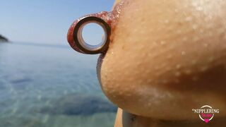 nippleringlover - horny milf pissing on the nude beach, pierced pussy, wide open, huge pierced nipples