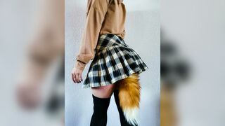 A schoolgirl with a fox tail is having fun. MadamFox