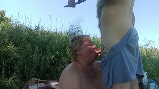 mouth and face covered in cum from a blowjob in nature