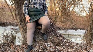 Curvy MILF without panties masturbates outdoors with pantyhose down