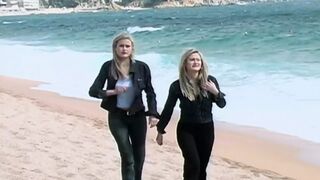 An amazing looking blonde MILF pleasing a cock on the beach