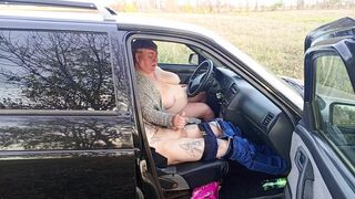 jerking off a dick in a car in nature