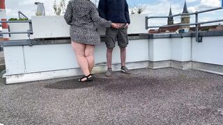 Gorgeous pissing mother-in-law helps son-in-law piss on the top of the parking lot