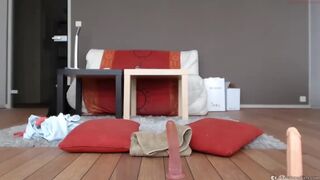 long-haired teen playing with a dildo